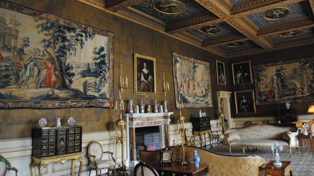 Inner room of Chirk Castle filled with paintings