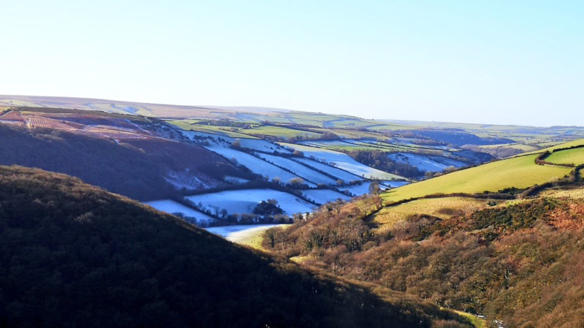 Snow-covered hills on the Lynmouth Circular with sunrise