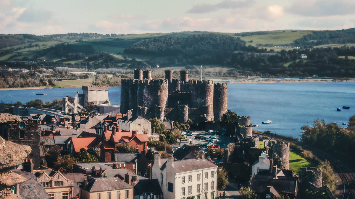 Conwy Castle standing tall among houses